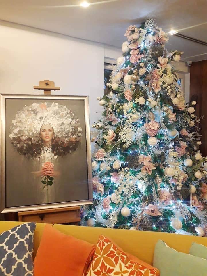 Regine Velasquez's portrait by artist Will Bart sits on an easel by her pastel-themed Christmas tree. The portrait was a birthday gift to her from her sister, Cacai. Regine Velasquez's portrait by artist Will Bart sits on an easel by her pastel-themed Christmas tree. The portrait was a birthday gift to her from her sister, Cacai.